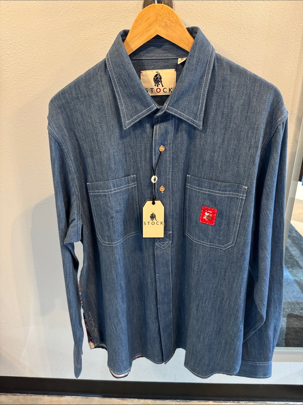 STOCK Woodstock Denim Button-Up Shirt in Indigo Blue. Inside cuffs embroidered.